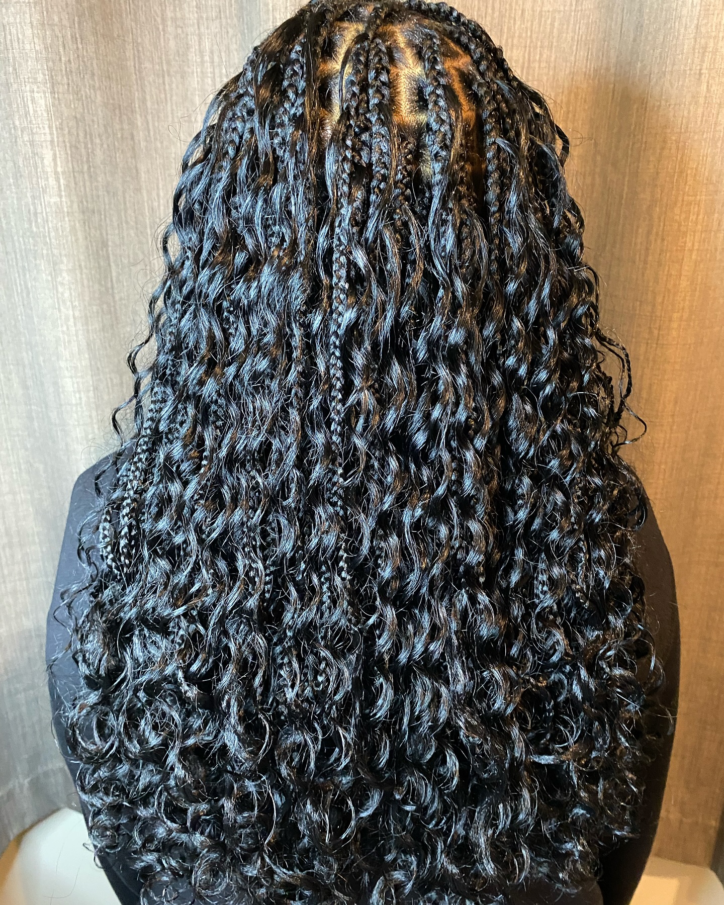 Long knotless boho braids with curly ends by Hair by Sham, Leicester